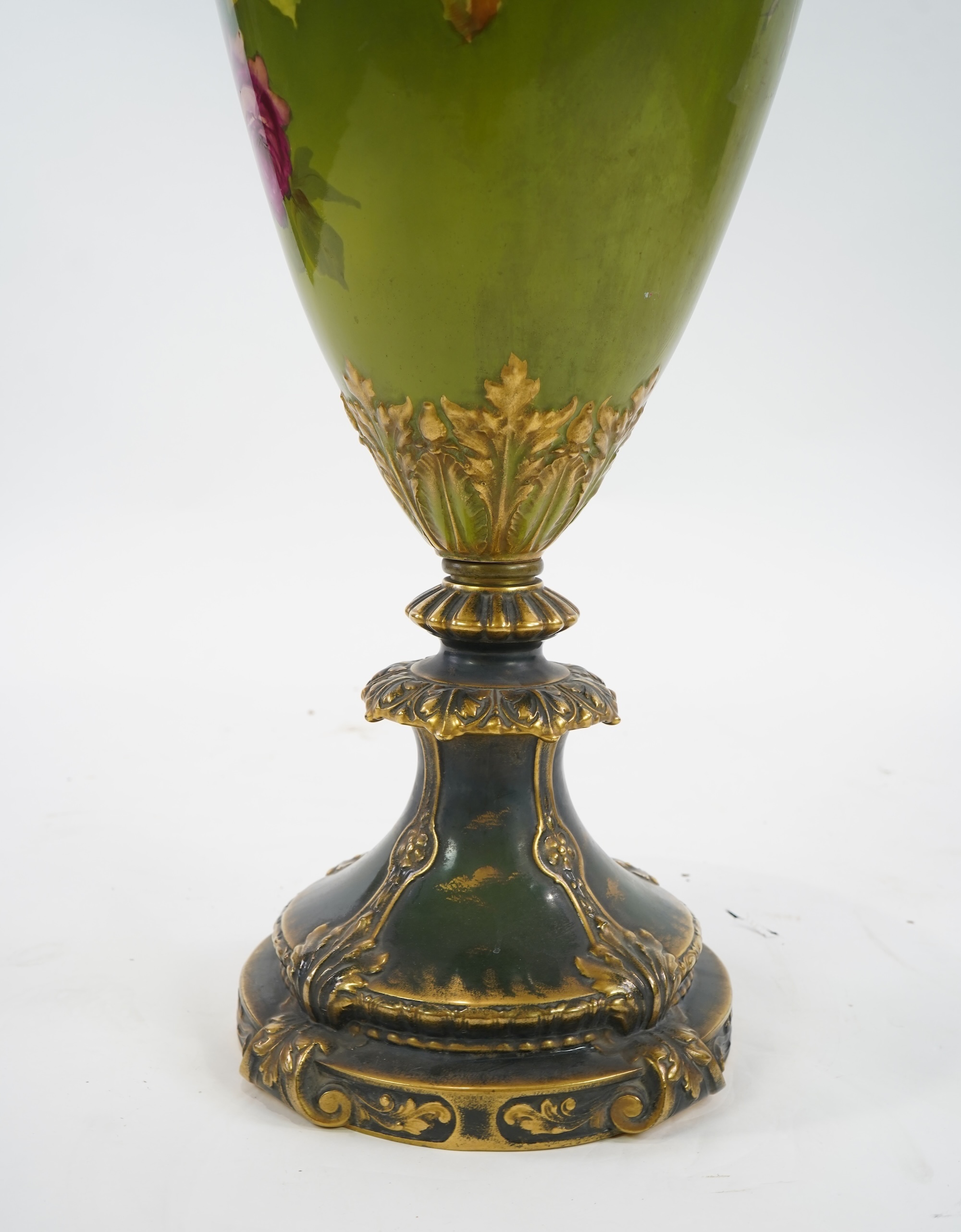 An exhibition size Continental rose painted pottery vase, late 19th/early 20th century